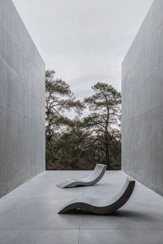 Brutalist Concrete Outdoor Space with Sculptural Chairs and Trees