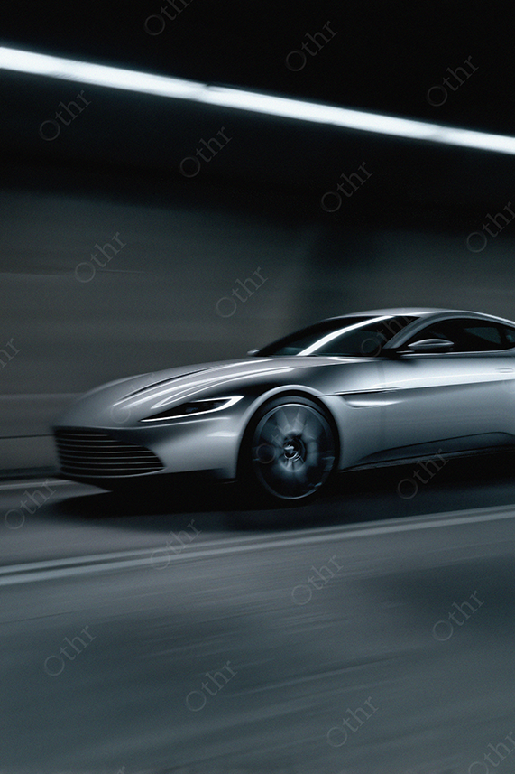 Silver Sports Car in Motion Through Tunnel