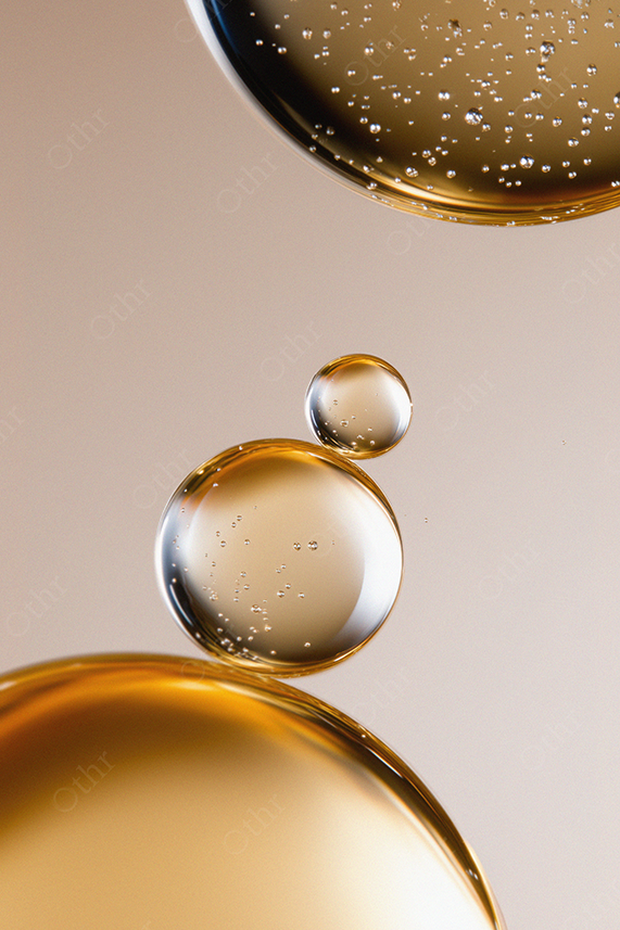 Gold Liquid Droplets Suspended in Oil With Tiny Bubbles