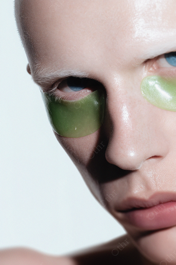 Portrait of a Model Wearing Green Under Eye Patches