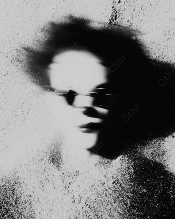 Blurry Clown Face with Sunglasses Projected onto Grainy Wall in Black and White