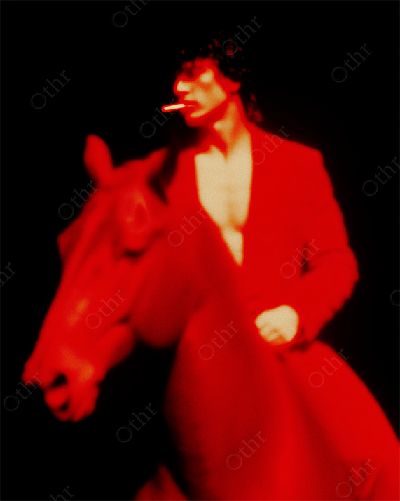 Man in Red Suit Riding Red Horse with Cigarette in Mouth Against Black Background – Soft Focus