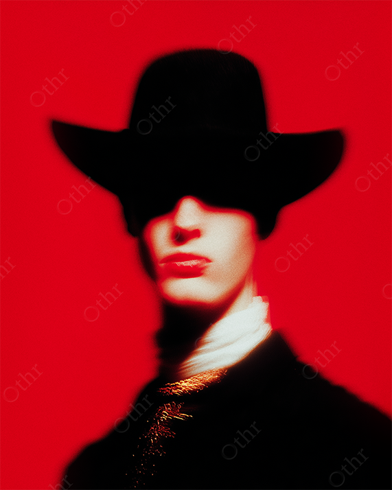 Blurry Portrait of Person in Wide-Brimmed Hat Against Red Backdrop