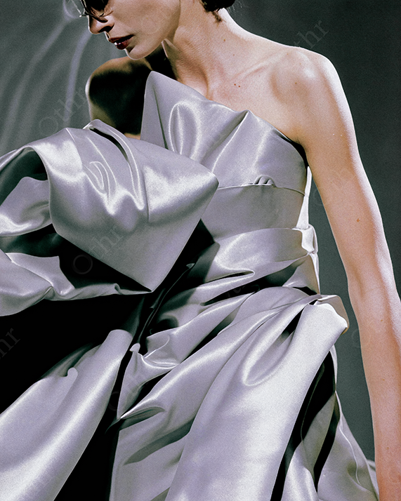 Woman in Strapless Structured Gown Made of Shiny Silver Fabric