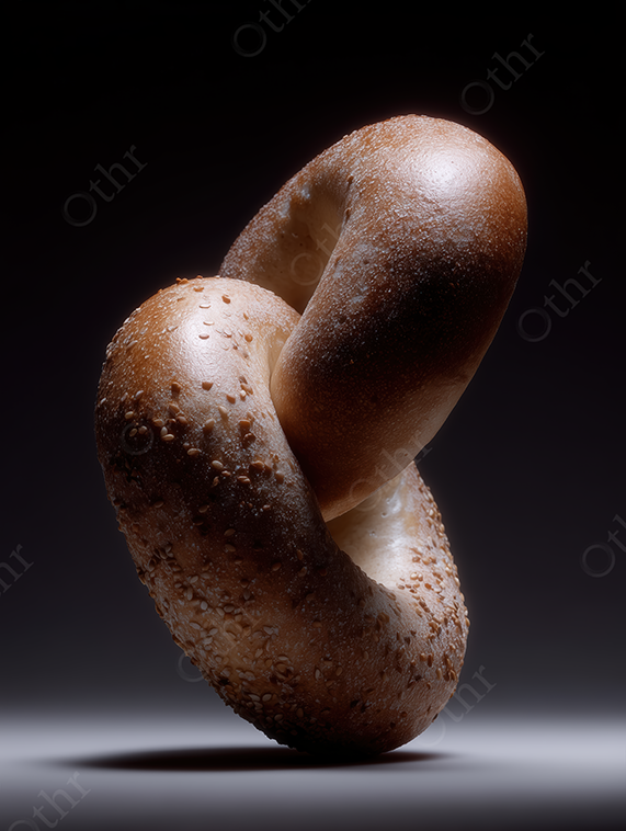 Interlocked Sesame Seed Bagels on Dark Gradient Background