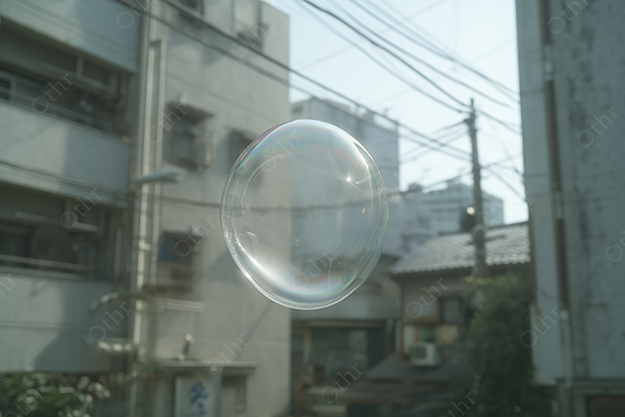 Transparent Soap Bubble Floating in Front of Urban Buildings and Power Lines