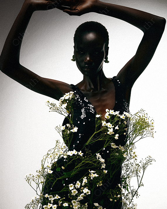 Fashion Portrait of a Person in Sequin Dress Adorned With White Wildflowers