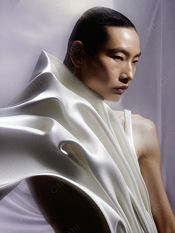 Studio Portrait of a Person Draped in Flowing White Satin Fabric
