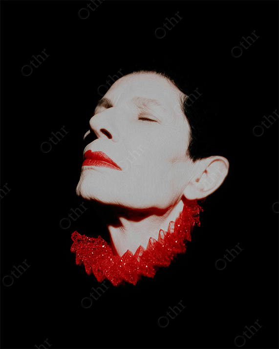 Close-Up Portrait of Person With Red Lips and Decorative Red Collar Against Black Background