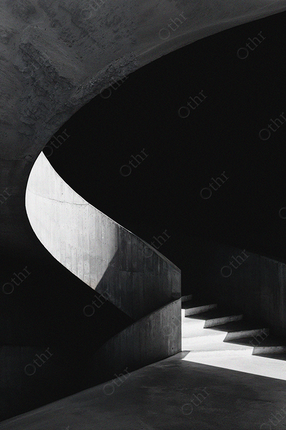Curved Concrete Staircase in Dramatic Shadow and Light