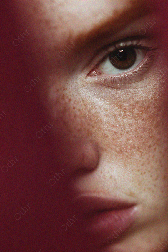 Close-Up of Freckled Face With Focus on Brown Eye