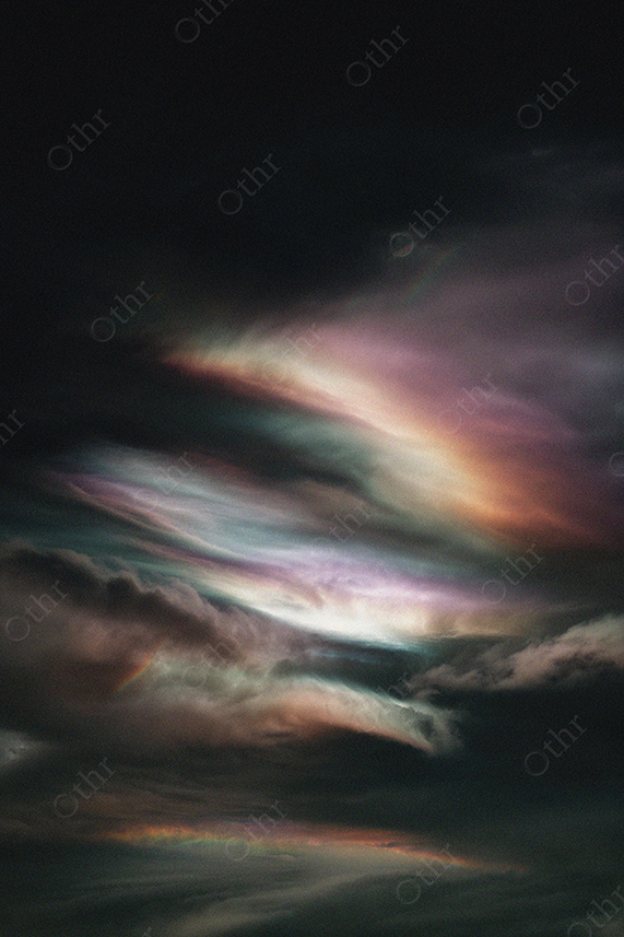 Iridescent Noctilucent Clouds Against Dark Sky