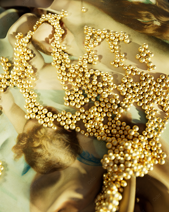 Gold Bead Forms Arranged Over a Classical Painted Figure in Warm Studio Lighting