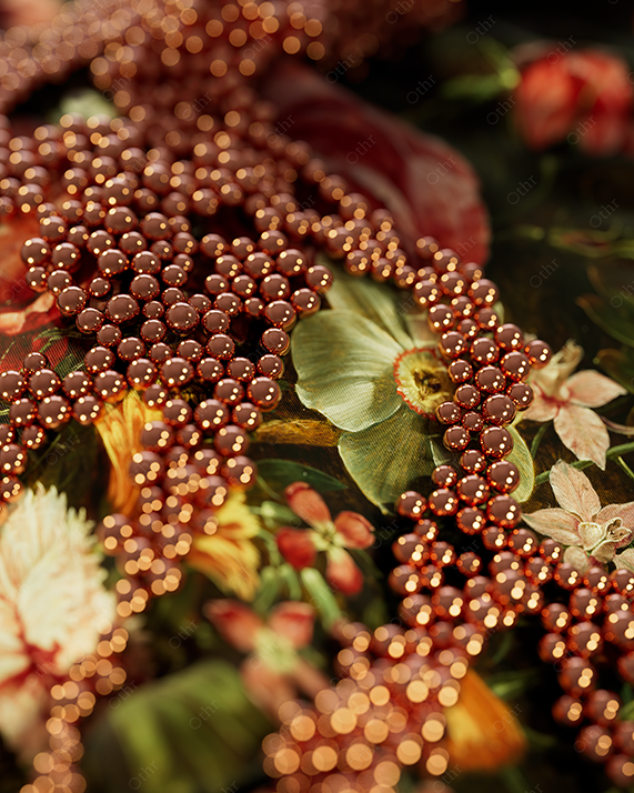 Copper Bead Patterns Arranged Over Floral Fabric With Warm, Shallow Depth of Field