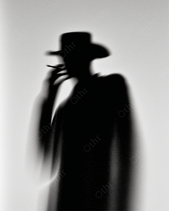 Monochrome cowboy silhouette smoking in haze.