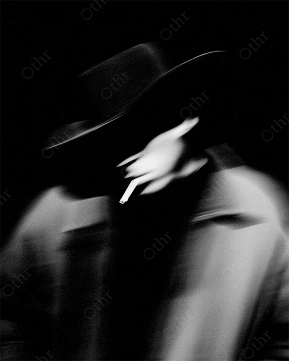 Monchrome Blurred Smoker in Wide Brim Hat