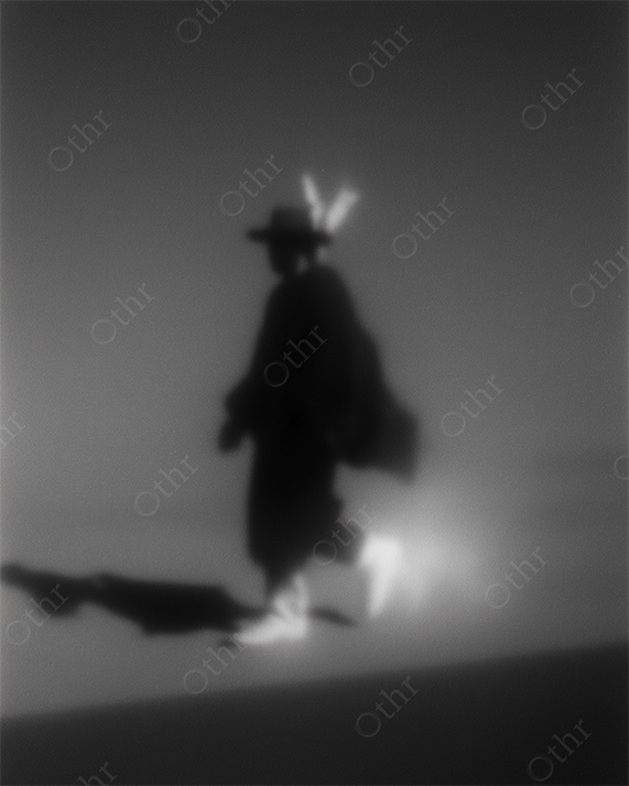 Monochrome Silhouetted Figure in Fog Wearing Wide-Brim Hat with Feathers