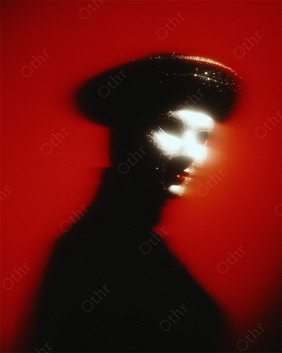 Face Lit by Intense Glow with Rhinestone Mask