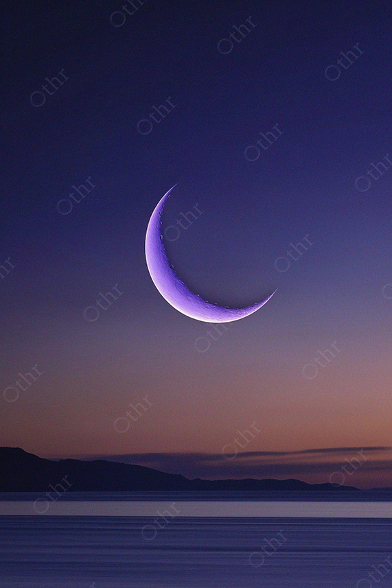 Purple Crescent Moon Over Water at Sunset