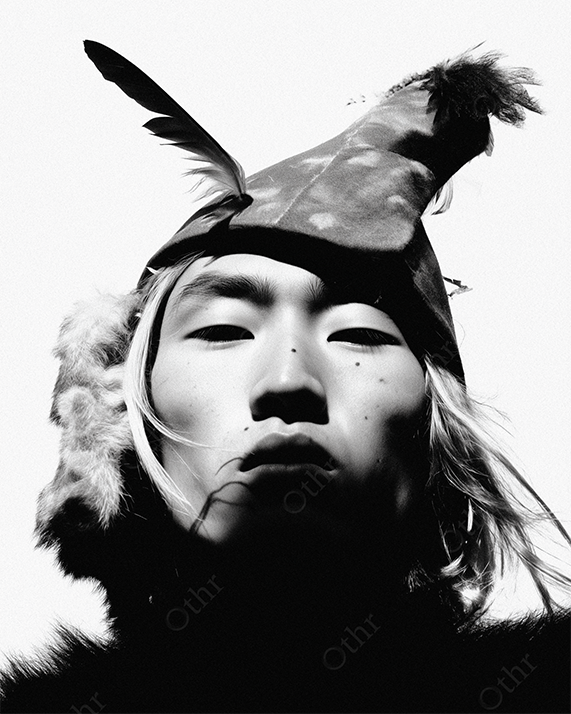 Black and White Portrait Of Person Wearing Feathered Hat