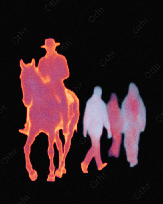 Glowing Silhouette of Cowboy Riding Horse with Three Figures in the Background