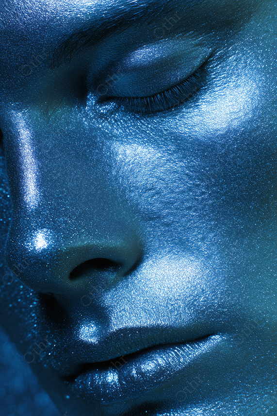 Close-up portrait with shimmering blue skin