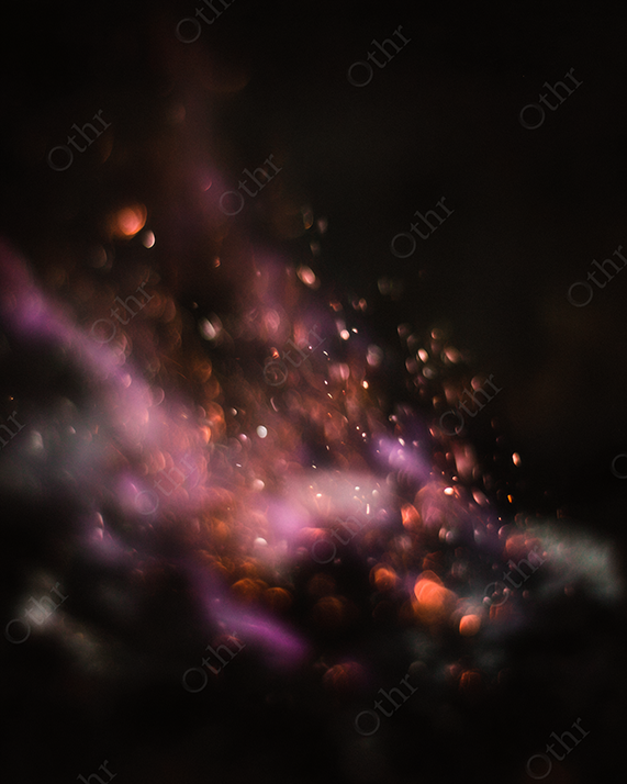 Close-Up of Orange Sparks and Purple Flame