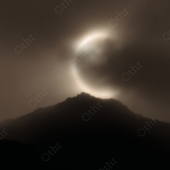 Solar Eclipse Ring Over Sharp Mountain Peak