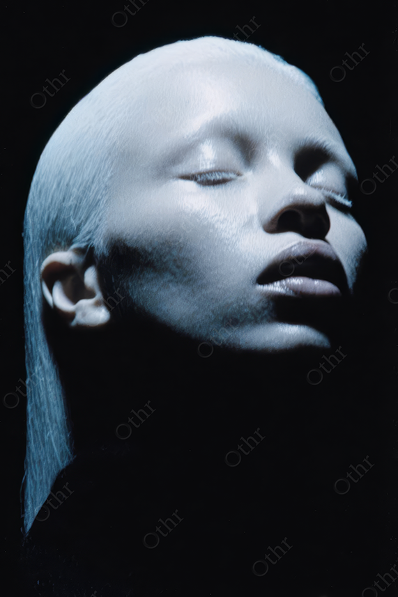 High Contrast Portrait of Pale Figure with White Hair