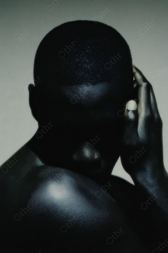 Backlit Figure with Hand to Side of Head