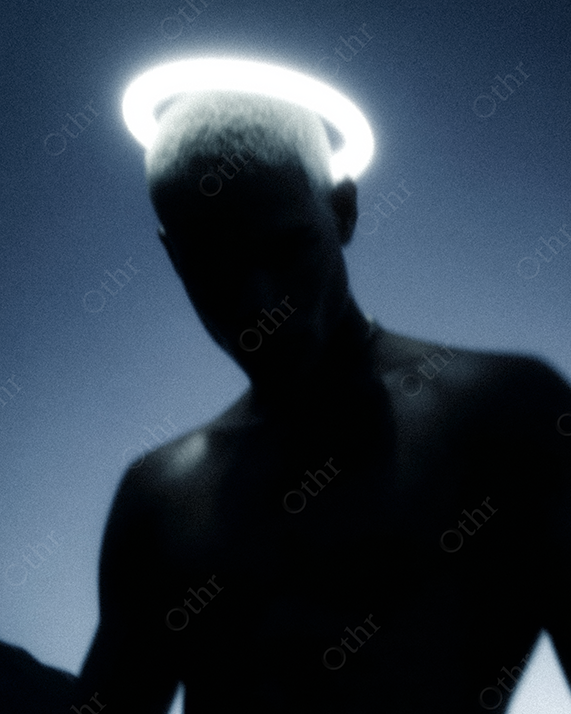 Blurry Shirtless Man with Glowing Halo in Blue Low Light Night Sky