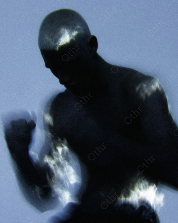Boxing Silhouette of Shirtless Man with Glowing Flame Highlights