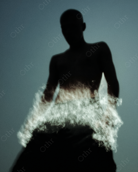 Shirtless Silhouette with Glowing Flames Erupting From Lower Body