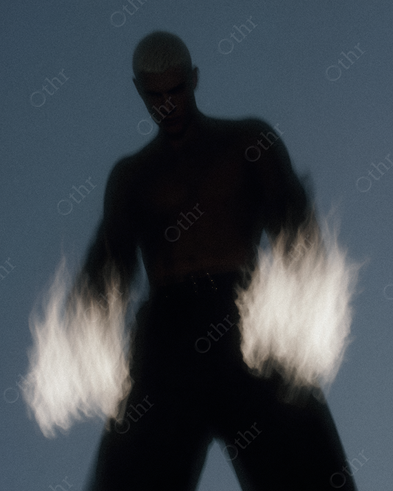 Shirtless Person with Blurred Flames Erupting From Both Hands