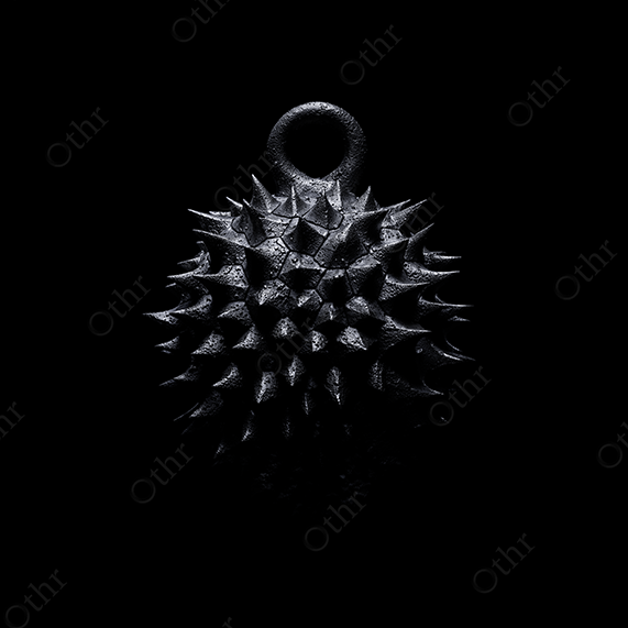 Spiked Metallic Durian Pendant on Black Background – Still Life