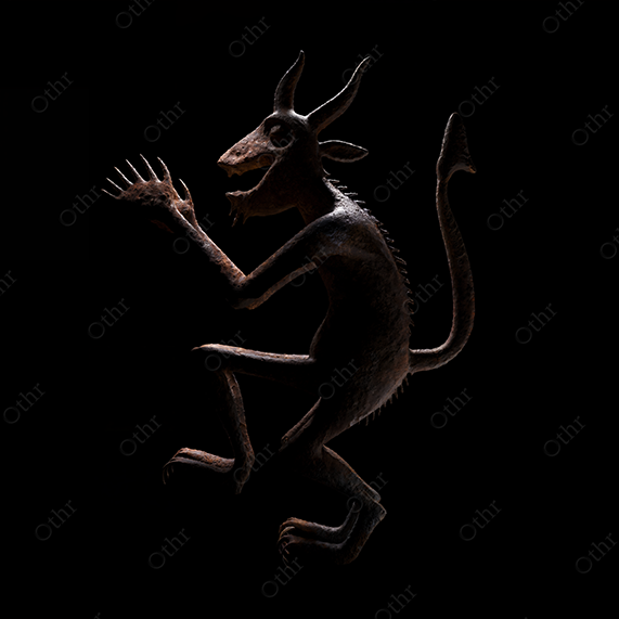 Horned Krampus Sculpture on Black Background – Artistic Still Life