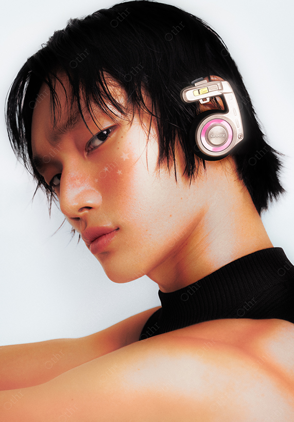 Close-Up Portrait of Man With Wet Hair Wearing Retro Pink Headphones and Black Collar