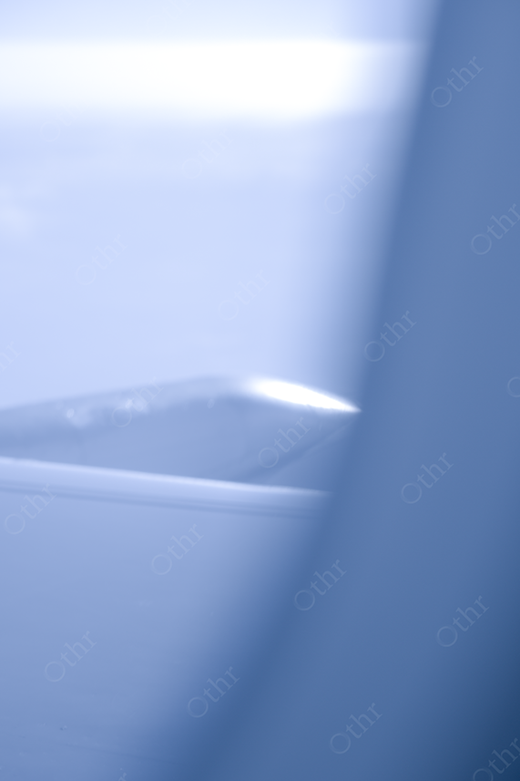Soft Blue-Toned View of an Aircraft Wing Through Window