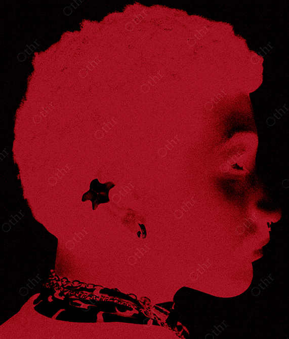 Red-Toned Side Profile of Person With Earrings and Textured Hair Against Black Background