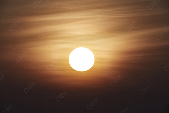 Sun Disc Glowing Through Hazy Evening Sky