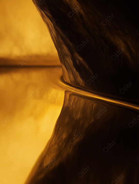Golden Rock Formation Reflected on a Smooth Liquid Surface