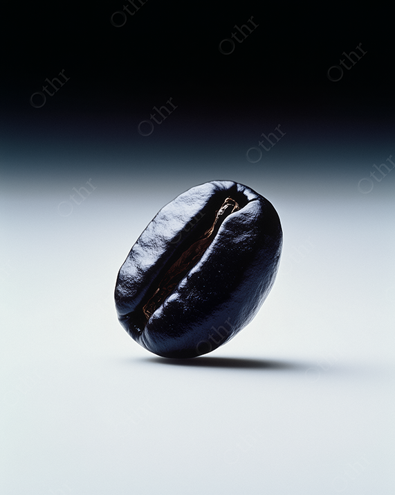 An isolated coffee bean with dramatic studio lighting.