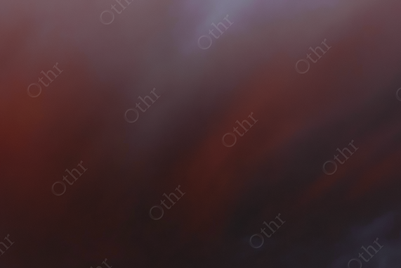 Blurred Red and Dark Clouds in Soft Evening Light