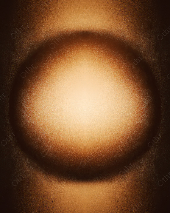 Soft Golden Light Forming a Circular Glow on Textured Surface