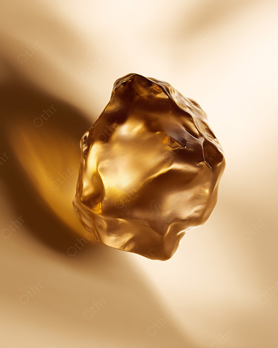 Translucent Golden Mineral Form Floating Against Soft Light