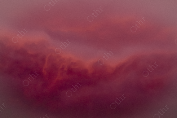Soft Red Clouds Forming a Faint Horizon at Dusk