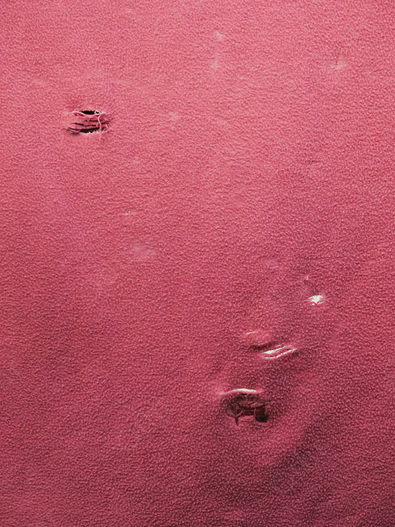 Textured Pink Surface With Subtle Indentations and Scratches