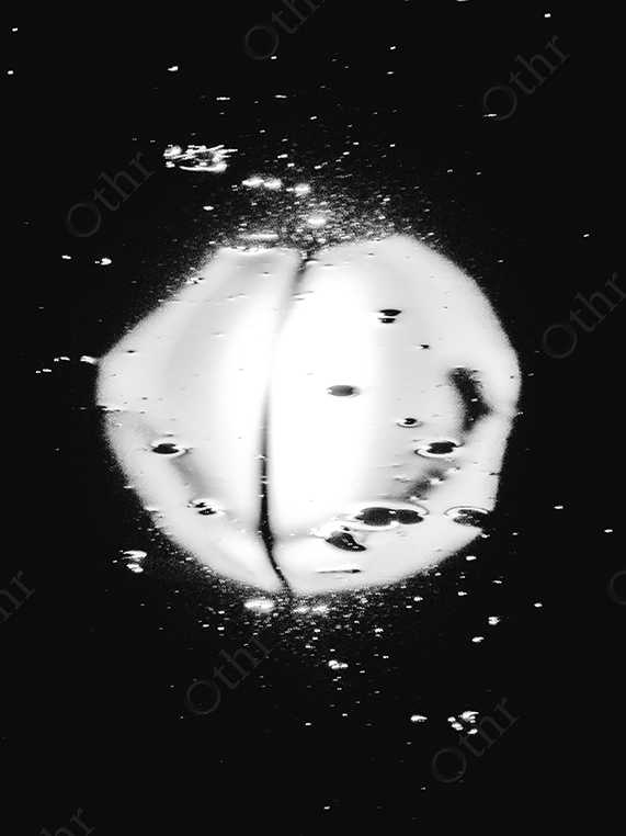 Abstract Monochrome Reflection of Bright Light on Water Surface