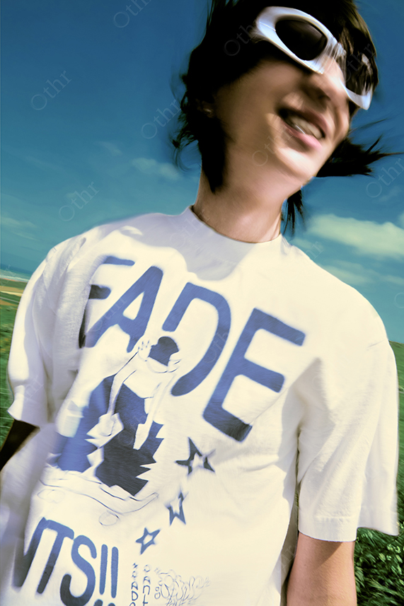 Blurred Portrait of Smiling Person Wearing White Sunglasses and Graphic T-Shirt Outdoors Under Blue Sky
