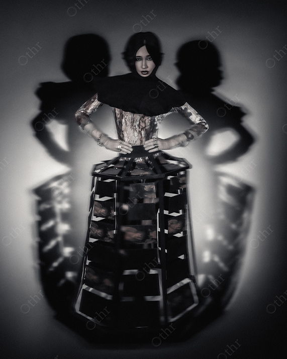 Woman Wearing Avant-Garde Structured Dress Standing Under Spotlight With Blurred Shadow Reflections Behind